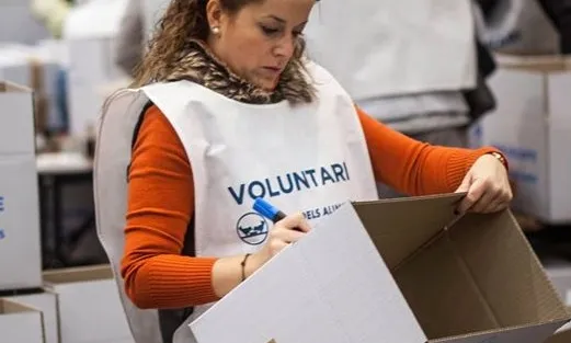 Voluntària del Gran Recapte d'Aliments de 2014. Font: Facebook del Gran Recapte