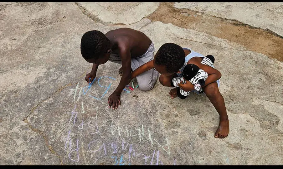 Cartell oficial de la XIII Exposició Fotogràfica de Gràcia Solidària.